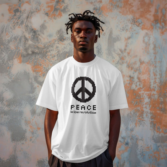 Person wearing a white oversized t-shirt with a black peace symbol design against a textured wall.